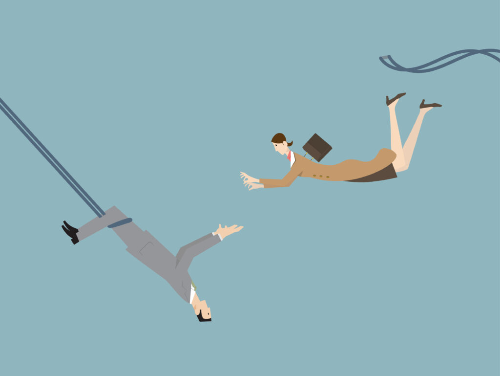 A funny illustration of a businessman catching a flying businesswoman as a trapeze artist.